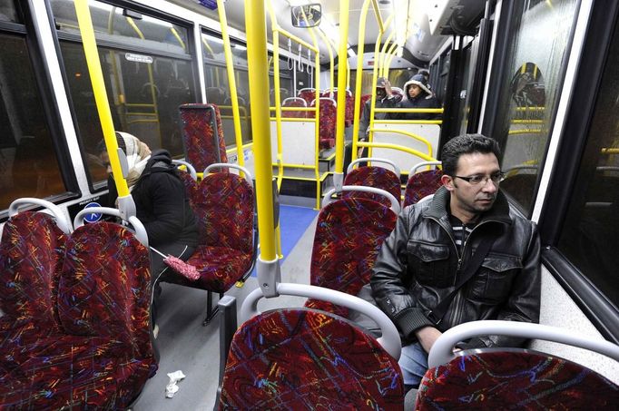 George Kapetanios takes a bus home to Potters Bar after leaving the Ta Dilina Greek restaurant in north London where he works as a chef