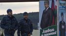 Security guards walk near the museum of late Chechen president Akhmad Kadyrov, with his portrait seen in the background, in Grozny in Chechnya, April 22, 2013. If Tamerlan Tsarnaev was already plotting the Boston Marathon bombings when he stayed in this bustling Russian city at the heart of an Islamist insurgency last year, neighbours say he hid it well. The ethnic Chechen killed in a shootout with U.S. police last week spent at least a month last summer helping his father renovate his first-floor apartment next door to a dentistry in Makhachkala, a city in the Dagestan region on the Caspian Sea. The Caucasian Knot website, which monitors the violence, says 124 people were killed and 75 wounded in the first three months of his year in predominantly Muslim Russian provinces that stretch almost from the Caspian to the Black Sea, and include Dagestan and Chechnya. REUTERS/Maxim Shemetov (RUSSIA - Tags: CRIME LAW CIVIL UNREST SOCIETY POLITICS) Published: Dub. 22, 2013, 7:12 odp.