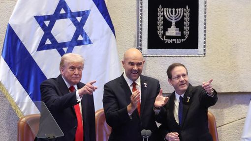 President Donald Trump reacts as he receives a standing ovation before speaking at the Knesset, Israel's parliament, Monday, Oct. 13, 2025 in Jerusalem. (Evelyn Hockstein