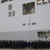Russian sailors gather in front of the Mistral-class helicopter carrier Vladivostok at the STX Les Chantiers de l'Atlantique shipyard site in Saint-Nazaire