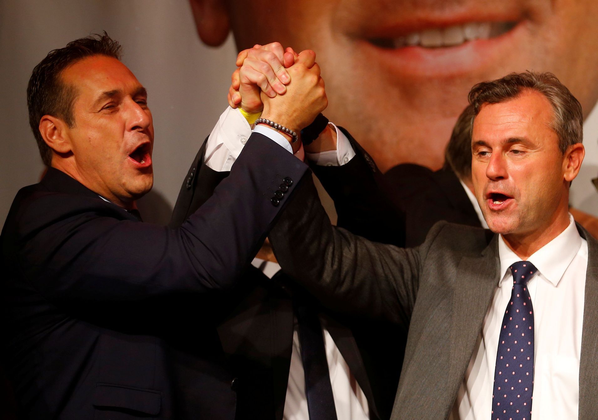 Presidential candidate Hofer of the Austrian Freedom Party (FPOe) and party head Strache sing a song during party celebrations after Austrian presidential election in Vienna