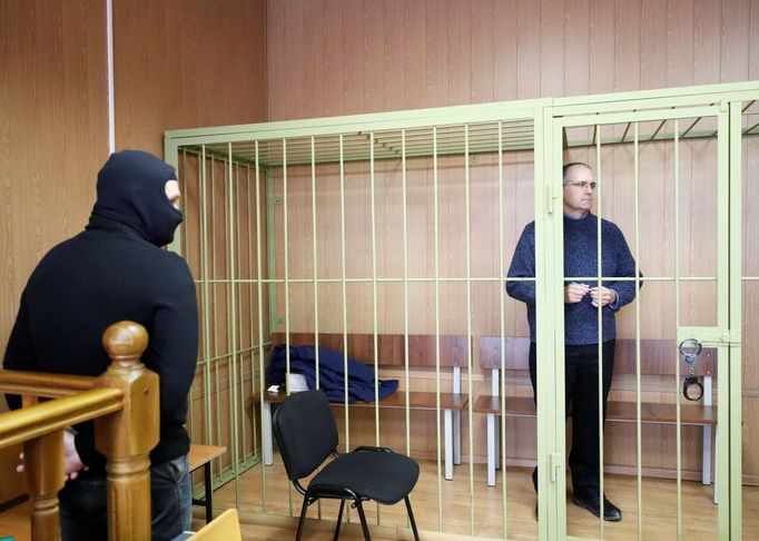 Former U.S. marine Paul Whelan who is being held on suspicion of spying, stands in the courtroom cage after a ruling regarding extension of his detention, in Moscow, Russ