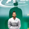Mercedes Formula One driver Hamilton of Britain waits to receive the trophy after winning the Japanese F1 Grand Prix at the Suzuka Circuit