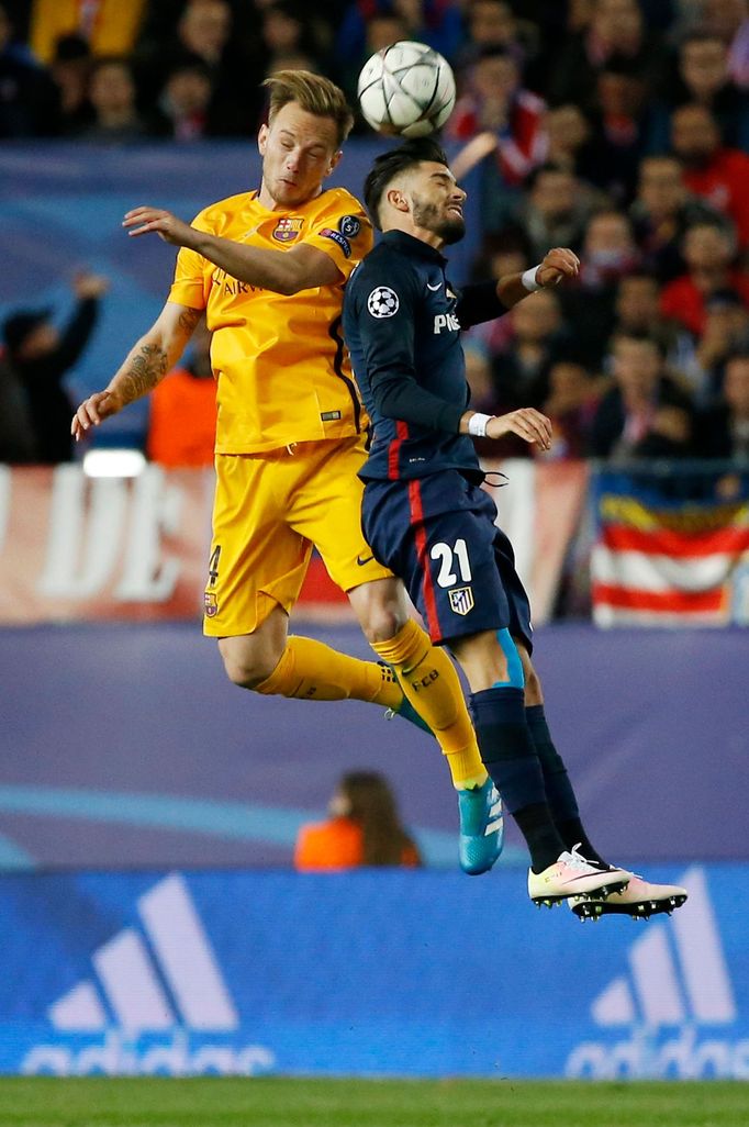 Atletico's Yannick Ferreira-Carrasco in action with Barcelona's Ivan Rakitic