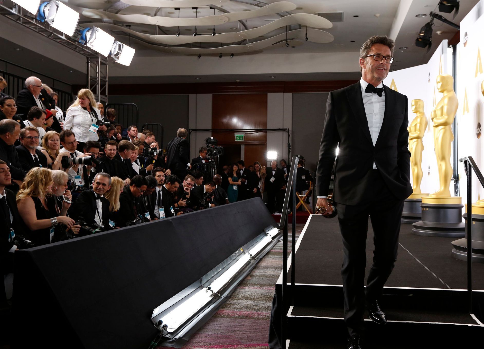 Director Pawel Pawlikowski walks off stage with his Oscar for best foreign language film for &quot;Ida&quot; during the 87th Academy Awards in Hollywood, California
