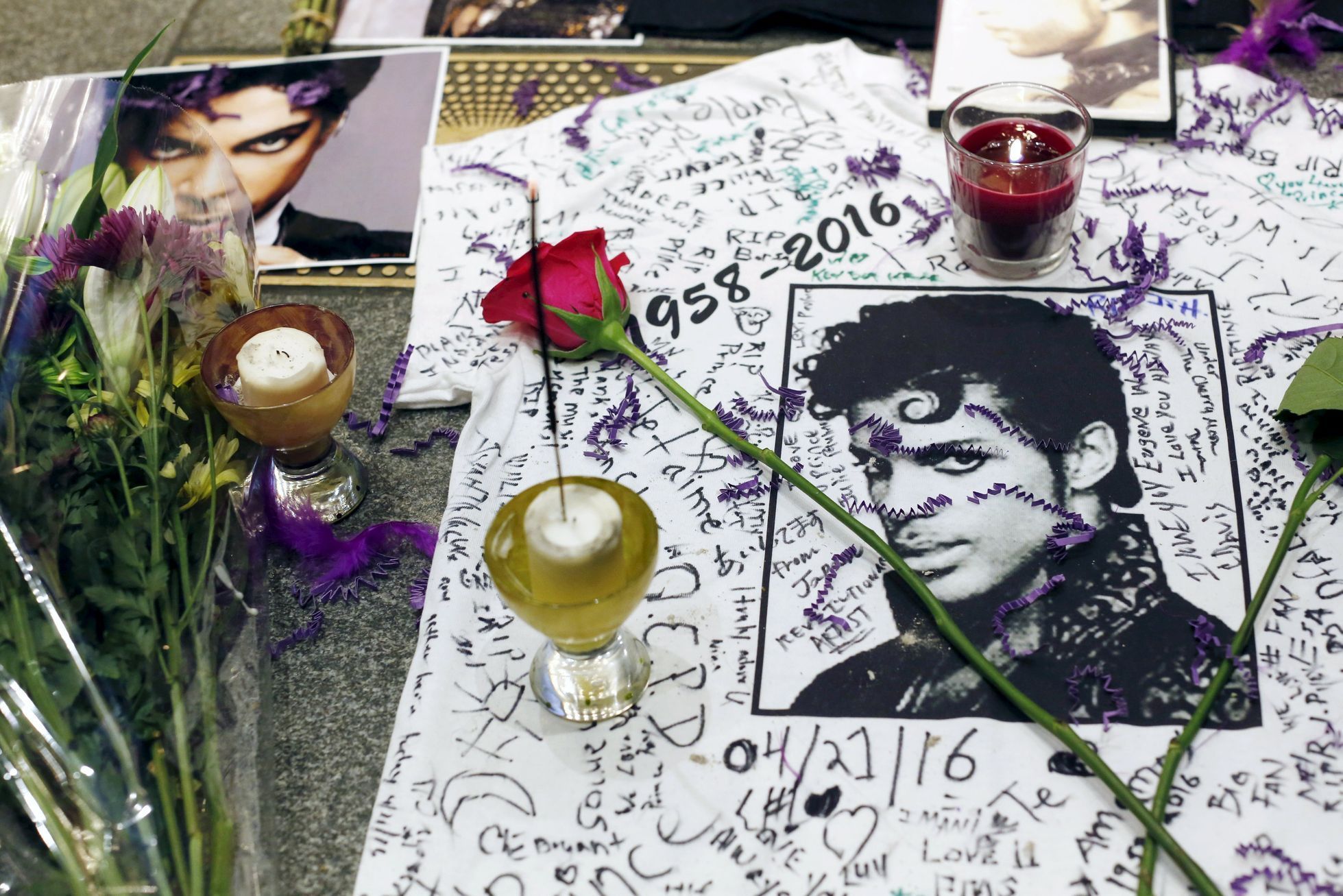 A makeshift memorial is seen as fans gather at Harlem's Apollo Theater to celebrate the life of deceased musician Prince in the Manhattan borough of New York, U.S.