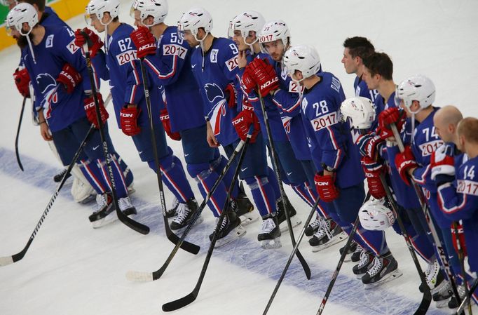 France's players react after their men's ice hockey World Championship quarter-final game against Russia at Minsk Arena in Minsk May 22, 2014. REUTERS/Alexander Demianchu