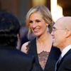 Actress Julia Roberts speaks with CEO of DreamWorks Jeffrey Katzenberg and his wife Marilyn Katzenberg on the red carpet at the 86th Academy Awards in Hollywood