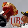 Mercedes Formula One driver Lewis Hamilton of Britain waves his trophy on the winners' podium, after winning the Chinese F1 Grand Prix at the Shanghai International circuit
