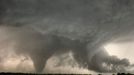 Tornado and the Alligator Head A very strange alligator-head shaped cloud forms to the right of a large tornado, under the massive supercell near Hill City Kansas, June 9, 2005. The portion shaped like the alligator head is a form of inflow cloud, just forming itself into this rather rare shape. The head clearly had its eyes on Hill City, right under its nose.