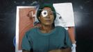 A patient with cataract lies on a hospital bed upon receiving anesthesia during a cataract surgery at the Tilganga Eye Center in Kathmandu April 25, 2012. About 150,000 of Nepal's 26.6 million people are estimated to be blind in both eyes, most of them with cataracts. Picture taken April 25, 2012. REUTERS/Navesh Chitrakar (NEPAL - Tags: HEALTH SOCIETY POVERTY TPX IMAGES OF THE DAY) Published: Kvě. 2, 2012, 4:25 dop.