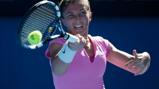 Sara Errani of Italy hits a return to Julia Goerges of Germany during their women's singles match at the Australian Open 2014 tennis tournament in Melbourne January 13, 2