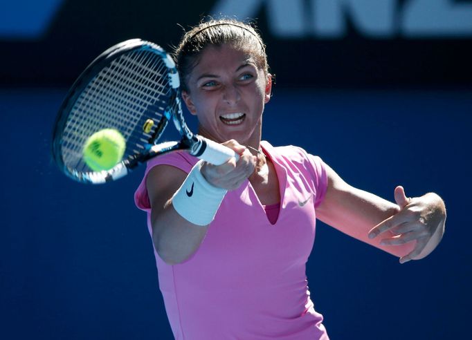 Sara Errani of Italy hits a return to Julia Goerges of Germany during their women's singles match at the Australian Open 2014 tennis tournament in Melbourne January 13, 2