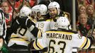 Boston Bruins left wing Daniel Paille (20) is mobbed by teammates Adam McQuaid (54), Brad Marchand (63), and Tyler Seguin (19), after scoring in overtime against the Chic