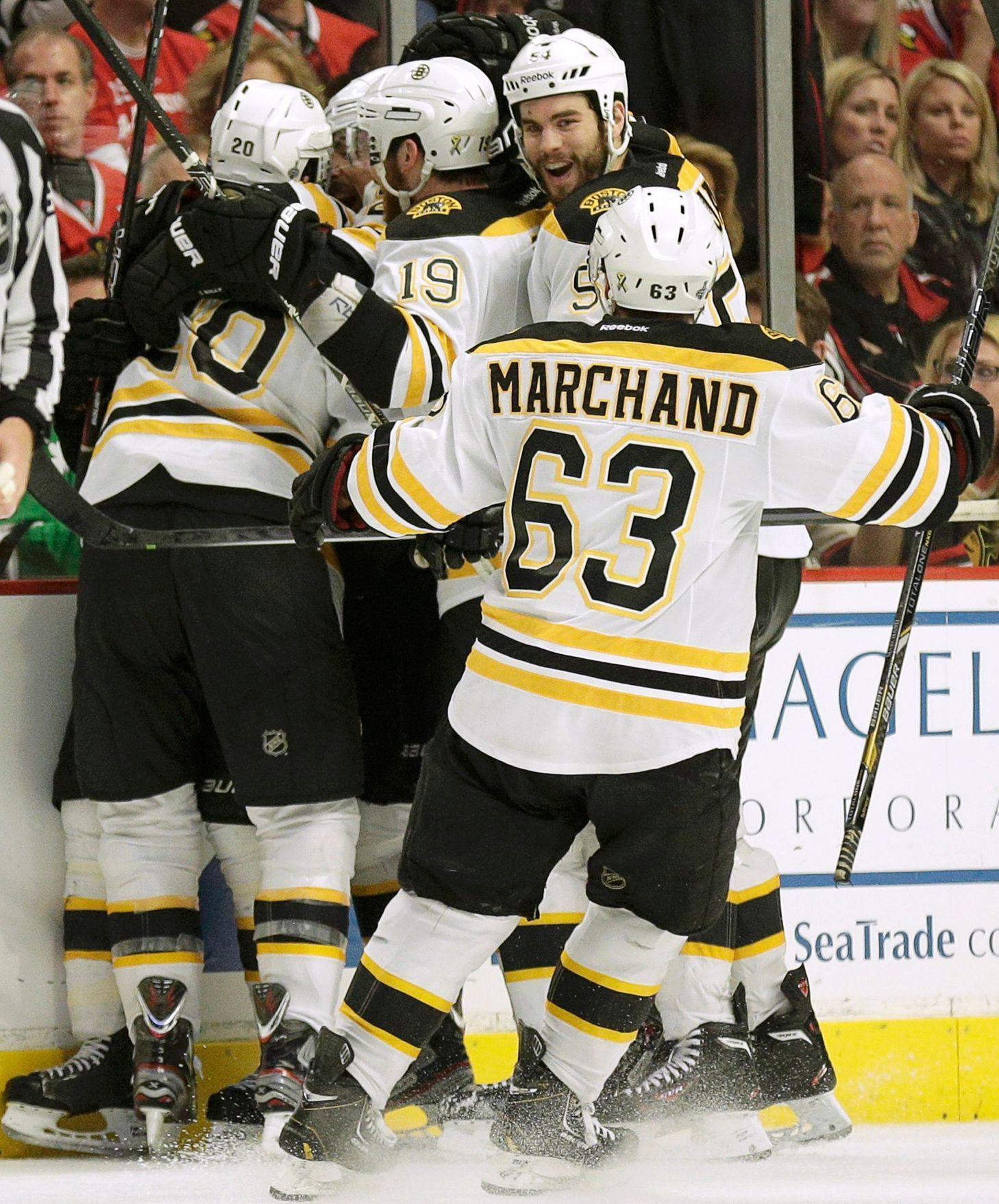 Bruins Paille is mobbed by teammates after scoring in overti