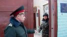 Staff talks near a gate to Kachanivska penitentiary colony for women in Kharkiv on March 16, 2012, where former Ukrainian Prime Minister and opposition leader Yulia Tymoshenko is currently held.