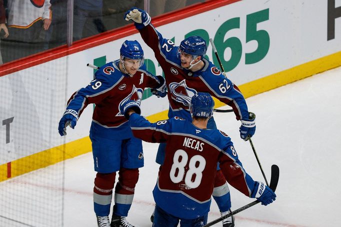 Feb 26, 2025; Denver, Colorado, USA; Colorado Avalanche center Nathan MacKinnon (29) celebrates his goal with center Martin Necas (88) and left wing Artturi Lehkonen (62)