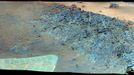 'Greeley Haven' Site for Opportunity's Fifth Martian Winter (False Color) This mosaic was acquired by the Mars Exploration Rover Opportunity's Panoramic Camera (Pancam) on Sol 2793 (Dec. 2, 2011). It shows a north-facing outcrop, informally named "Greeley Haven," where Opportunity will work during the rover's fifth Martian winter. The rover team chose this designation as a tribute to the influential planetary geologist Ronald Greeley (1939-2011), who was a member of the science team for the Mars rovers and many other interplanetary missions. The site is of interest not only for its geologic features but because it has favorable northerly slopes to optimize Opportunity's solar energy as winter approaches in the southern hemisphere of Mars. After this mosaic was acquired, Opportunity backed up the slope to park at approximately 16 degrees northerly tilt and used tools on its robotic arm (Instrument Deployment Device, or IDD) to examine rock and soil targets. After deciding that the site could serve the mission well for the next several months, the team designated it as a memorial for Greeley, who taught generations of planetary scientists at Arizona State University, Tempe, until his death on Oct. 27, 2011. The site is near the northern tip of the "Cape York" segment of the western rim of Endeavour Crater. The image combines exposures taken through Pancam filters centered on wavelengths of 753 nanometers (near infrared), 535 nanometers (green) and 432 nanometers (violet). The view is presented in false color to make some differences between materials easier to see. Plans for research continuing through the months at Greeley Haven include a radio-science investigation of the interior of Mars, inspections of mineral compositions and textures on the outcrop, and assembly of a full-circle, color panorama of the surroundings. The planned full-circle image will be called the Greeley Panorama. Image Credit: NASA/JPL-Caltech/Cornell/Arizona State Univ.