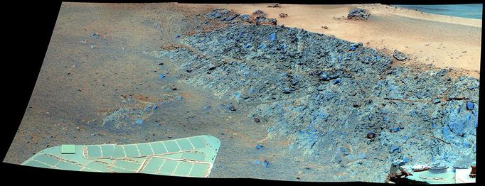 'Greeley Haven' Site for Opportunity's Fifth Martian Winter (False Color) This mosaic was acquired by the Mars Exploration Rover Opportunity's Panoramic Camera (Pancam) on Sol 2793 (Dec. 2, 2011). It shows a north-facing outcrop, informally named "Greeley Haven," where Opportunity will work during the rover's fifth Martian winter. The rover team chose this designation as a tribute to the influential planetary geologist Ronald Greeley (1939-2011), who was a member of the science team for the Mars rovers and many other interplanetary missions. The site is of interest not only for its geologic features but because it has favorable northerly slopes to optimize Opportunity's solar energy as winter approaches in the southern hemisphere of Mars. After this mosaic was acquired, Opportunity backed up the slope to park at approximately 16 degrees northerly tilt and used tools on its robotic arm (Instrument Deployment Device, or IDD) to examine rock and soil targets. After deciding that the site could serve the mission well for the next several months, the team designated it as a memorial for Greeley, who taught generations of planetary scientists at Arizona State University, Tempe, until his death on Oct. 27, 2011. The site is near the northern tip of the "Cape York" segment of the western rim of Endeavour Crater. The image combines exposures taken through Pancam filters centered on wavelengths of 753 nanometers (near infrared), 535 nanometers (green) and 432 nanometers (violet). The view is presented in false color to make some differences between materials easier to see. Plans for research continuing through the months at Greeley Haven include a radio-science investigation of the interior of Mars, inspections of mineral compositions and textures on the outcrop, and assembly of a full-circle, color panorama of the surroundings. The planned full-circle image will be called the Greeley Panorama. Image Credit: NASA/JPL-Caltech/Cornell/Arizona State Univ.