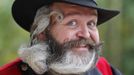 German hairdresser Elmar Weisser, 48, poses with his beard, which is shaped as a stork, during the 2012 European Beard and Moustache Championships in Wittersdorf near Mulhouse, Eastern France, September 22, 2012. Weisser, who won the World Beard and Moustache Championship in 2011, ranked second in the freestyle category of the European championships on Saturday. Picture taken September 22, 2012. REUTERS/Vincent Kessler (FRANCE - Tags: SOCIETY TPX IMAGES OF THE DAY) Published: Zář. 23, 2012, 11:40 dop.