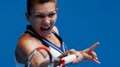 Simona Halep of Romania hits a return to Jelena Jankovic of Serbia during their women's singles match at the Australian Open 2014 tennis tournament in Melbourne