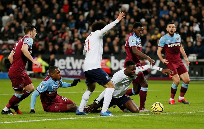 Soccer Football - Premier League - West Ham United v Liverpool - London Stadium, London, Britain - January 29, 2020   West Ham United's Issa Diop fouls Liverpool's Divock