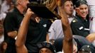 Miami Heat's Chris Bosh raises the Larry O'Brien Championship Trophy after his team defeated the San Antonio Spurs in Game 7 to take the NBA Finals basketball playoff in