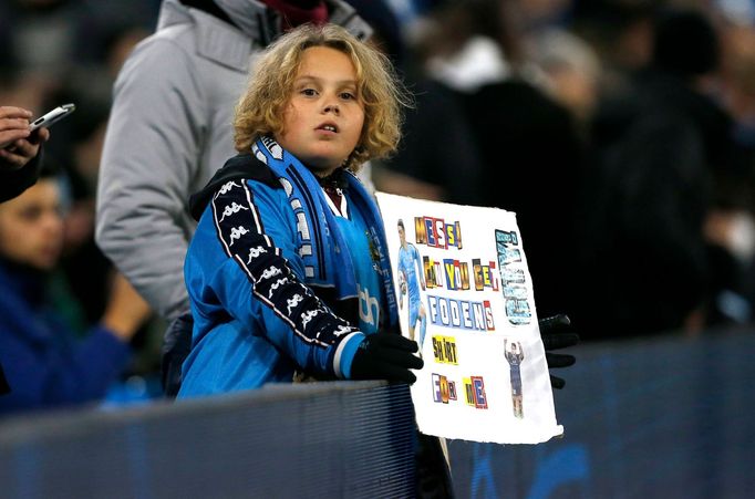 Soccer Football - Champions League - Group A - Manchester City v Paris St Germain - Etihad Stadium, Manchester, Britain - November 24, 2021 A Manchester City fan holds a