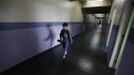 Gabriel Muniz, 11, walks to class at his school in Campos dos Goytacazes, 274 kilometres (170 miles) northeast of Rio de Janeiro August 23, 2012. Despite being born with malformation of his feet, fourth grader Gabriel puts in hours into soccer everyday in his neighbourhood. He aspires to be a professional soccer player just like his idol Argentina's Lionel Messi of Barcelona FC. REUTERS/Ricardo Moraes (BRAZIL - Tags: SPORT SOCCER SOCIETY TPX IMAGES OF THE DAY) Published: Srp. 24, 2012, 2:25 dop.