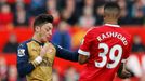 Manchester United's Marcus Rashford and Arsenal's Mesut Ozil