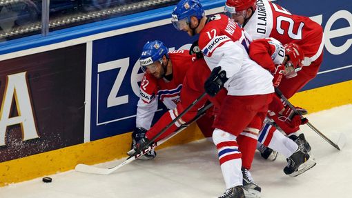 Michal Vondrka and Jiri Novotny of the Czech Republic battle for the puck with Denmark's Oliver Lauridsen and Jesper Jensen (L-R) during the second period of their men's