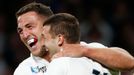 Jonny May of England celebrates with Sam Burgess after scoring the first try for his side