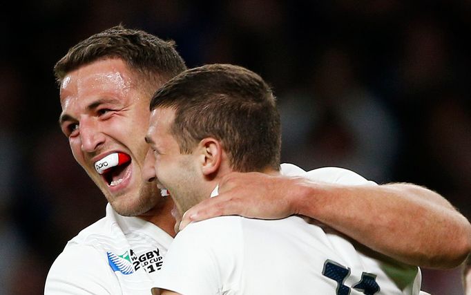 Jonny May of England celebrates with Sam Burgess after scoring the first try for his side