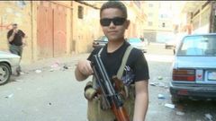 Child fighter with AK 47 on Syria border