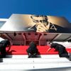 Workers install the red carpet in front of the main entrance of the Festival Palace for the opening ceremony of the 67th Cannes Film Festival in Cannes