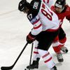Canada's Crosby fights for the puck with Switzerland's Blum during their Ice Hockey World Championship game at the O2 arena in Prague