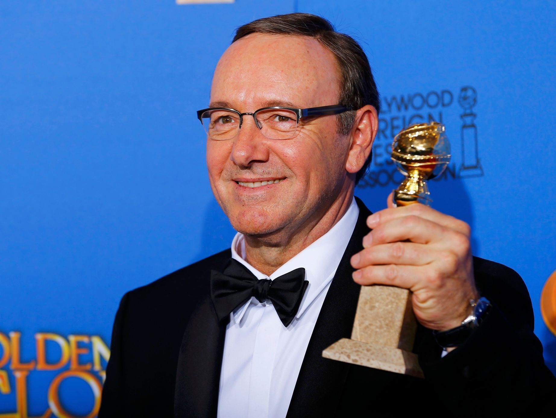 Actor Kevin Spacey poses backstage with his award for Best Performance by an Actor in a Television Series for &quot;House of Cards&quot; at the 72nd Golden Globe Awards in Beverly Hills