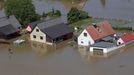 Houses are inundated by the waters of the Elbe river during floods near Magdeburg in the federal state of Saxony Anhalt, June 10, 2013. Tens of thousands of Germans, Hungarians and Czechs were evacuated from their homes on Wednesday as soldiers raced to pile up sandbags to hold back rising waters in the region's worst floods in a decade. REUTERS/Thomas Peter (GERMANY - Tags: DISASTER ENVIRONMENT)