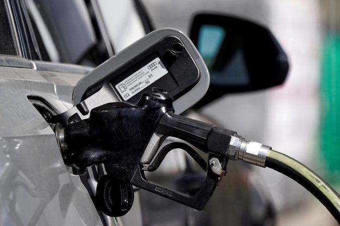 FILE PHOTO: A gas pump is inserted inside an Audi vehicle at a Mobil gas station in Beverly Boulevard in West Hollywood, California, U.S., March 10, 2022. Picture taken M