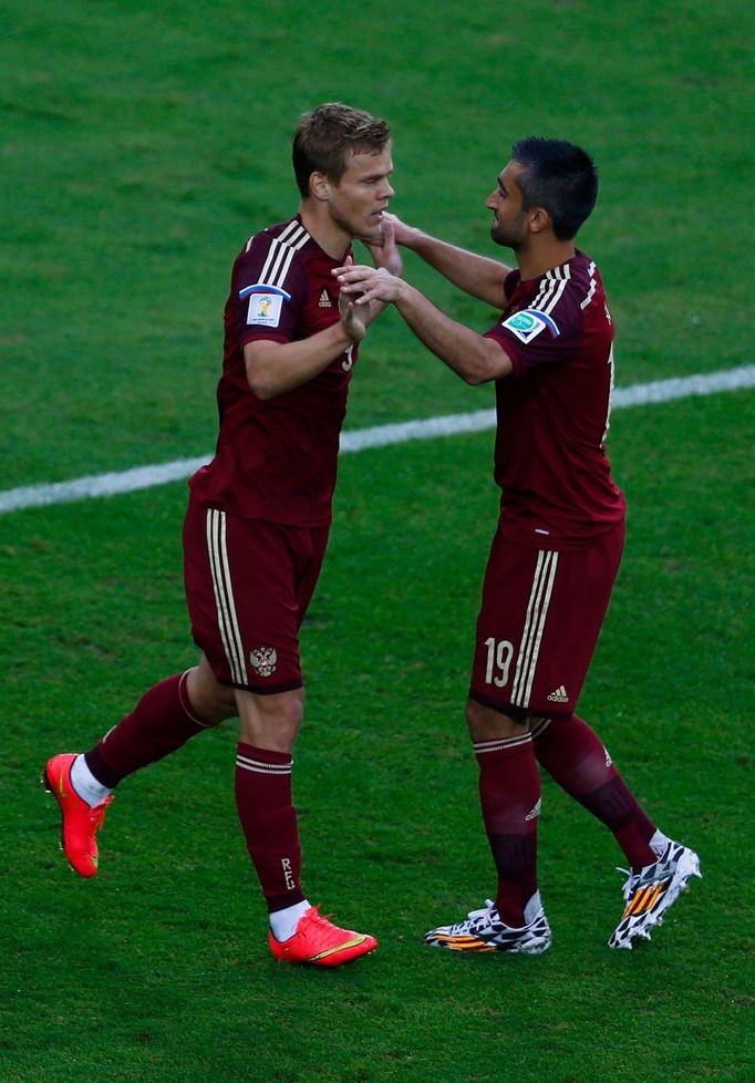 Russia's Alexander Kokorin (L) celebrates with teammate Alexander Samedov after scoring a goal against Algeria during their 2014 World Cup Group H soccer match at the Bai