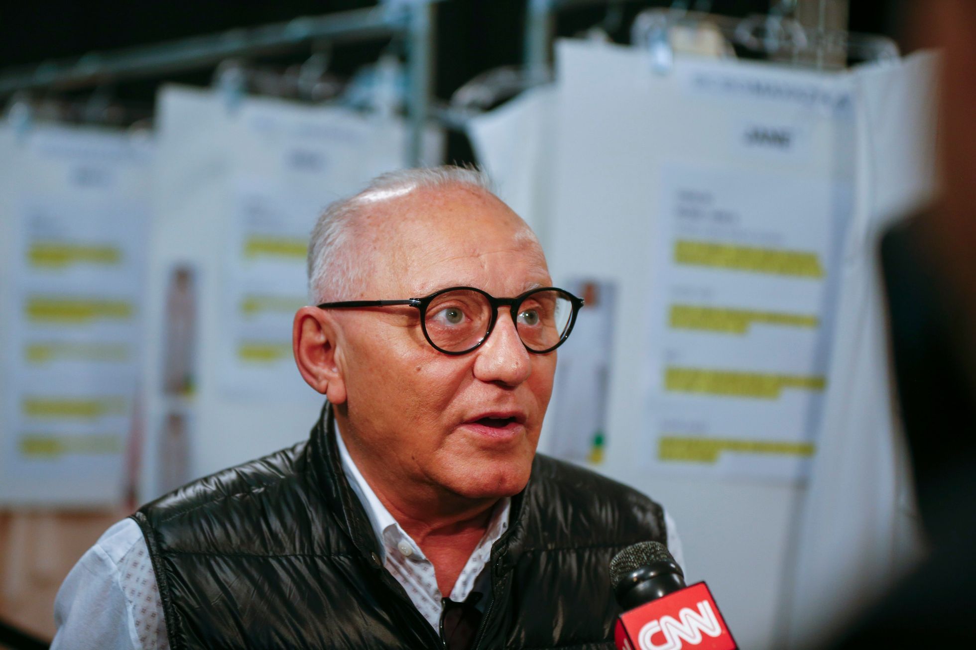Designer Max Azria is interviewed backstage before showing the BCBG Max Azria collection during New York Fashion Week