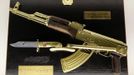 A gold plated Kalashnikov is seen on display at the 'Top Secret' Spy Museum in Oberhausen, July 10, 2013. The museum presents various objects, devices and gadgets used for spying or related to espionage. REUTERS/Ina Fassbender (GERMANY - Tags: SOCIETY ENTERTAINMENT) Published: Čec. 10, 2013, 2:57 odp.