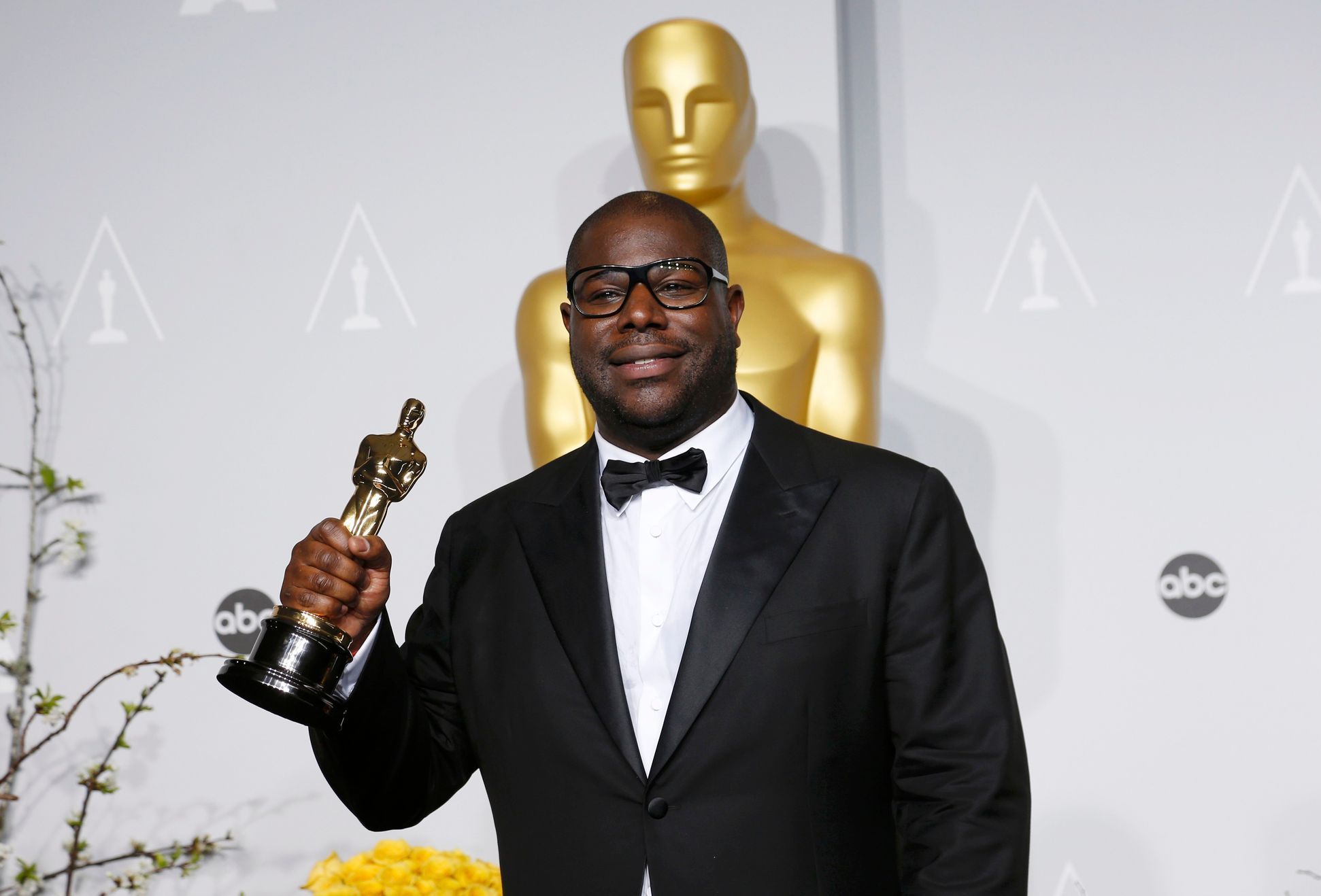 &quot;12 Years a Slave&quot; director Steve McQueen poses with his best picture award at the 86th Academy Awards in Hollywood