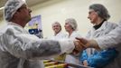 Hollande, Socialist Party candidate for French presidential election, shakes hands with employees during a campaign visit to a plant of frozen food giant Findus in Boulogne-sur-Mer