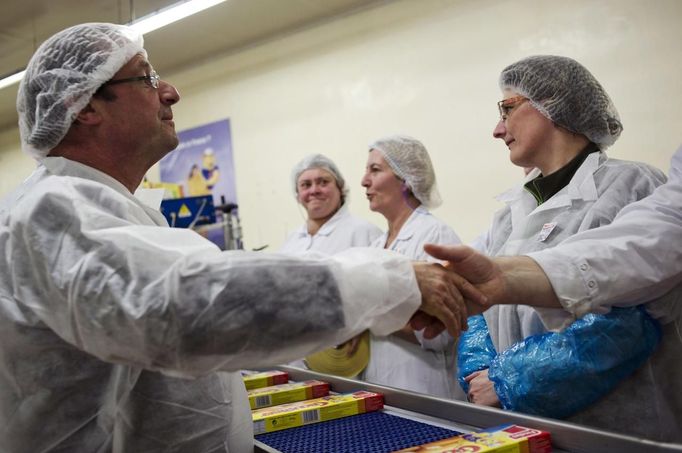 Hollande, Socialist Party candidate for French presidential election, shakes hands with employees during a campaign visit to a plant of frozen food giant Findus in Boulogne-sur-Mer