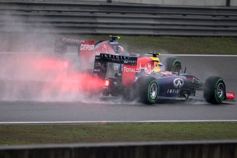 Red Bull Racing Formula One driver Ricciardo of Australia and Toro Rosso Formula One driver Kvyat of Russia drive during the third practice session of the Chinese F1 Grand Prix at the Shanghai Interna