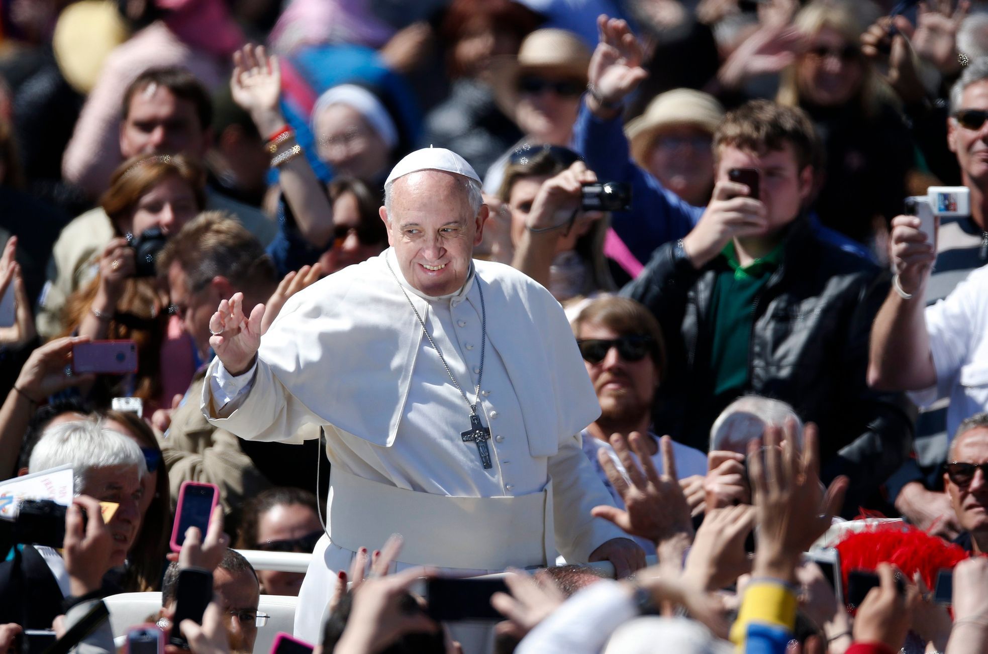 Pope Francis waves as he leads the Easter Mass in Saint Peter's Square at the Vatican