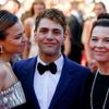 Director Xavier Dolan and cast members of the film &quot;Mommy&quot;, pose on the red carpet as they arrive at the closing ceremony of the 67th Cannes Film Festival