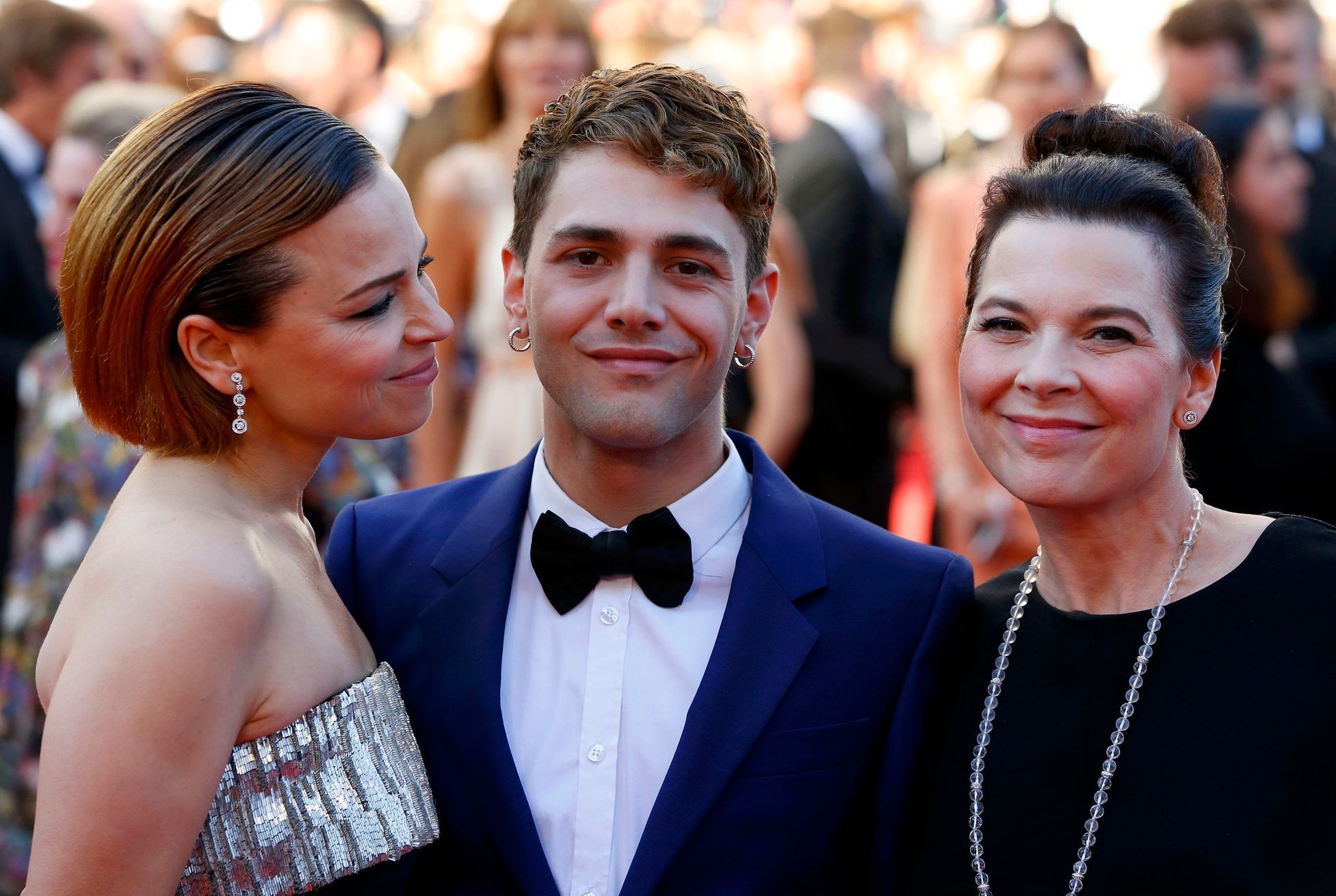 Director Xavier Dolan and cast members of the film &quot;Mommy&quot;, pose on the red carpet as they arrive at the closing ceremony of the 67th Cannes Film Festival