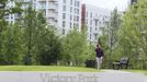 A LOCOG (London Organising Committee of the Olympic Games) employee crosses Victory Park in the Olympic Village built for the London 2012 Olympic Games in Stratford, east London on June 29, 2012. The village will accomodate up to 16,000 athletes and officials from more than 200 nations. Picture taken June 29, 2012. REUTERS/Olivia Harris (BRITAIN - Tags: BUSINESS CONSTRUCTION SPORT OLYMPICS CITYSPACE) Published: Čer. 30, 2012, 12:21 odp.